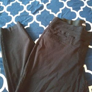 Womens black skinny leg dress pants.